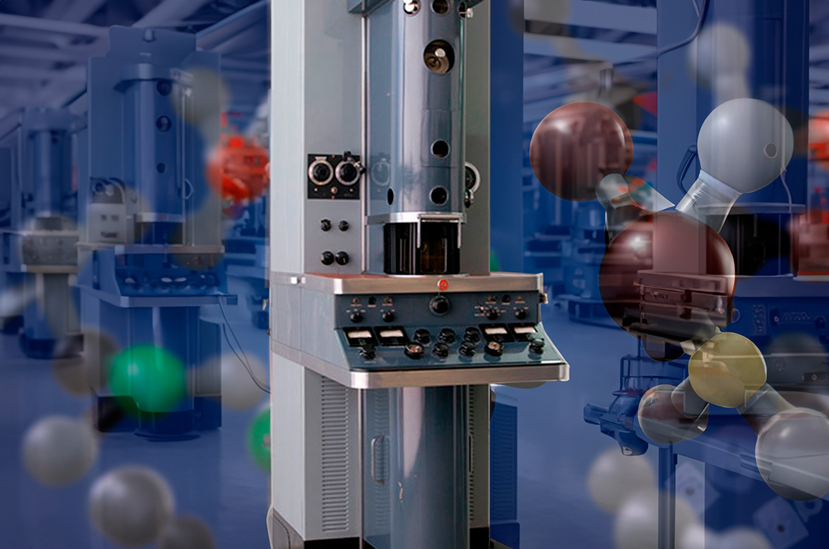 Imagen decorada de un microscopio en forma de columna de aluminio con un panel con mandos grandes del siglo pasado en el centro de la columna